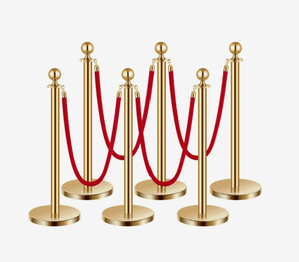 Gouden VIP afzetpalen met rode velours koorden huren